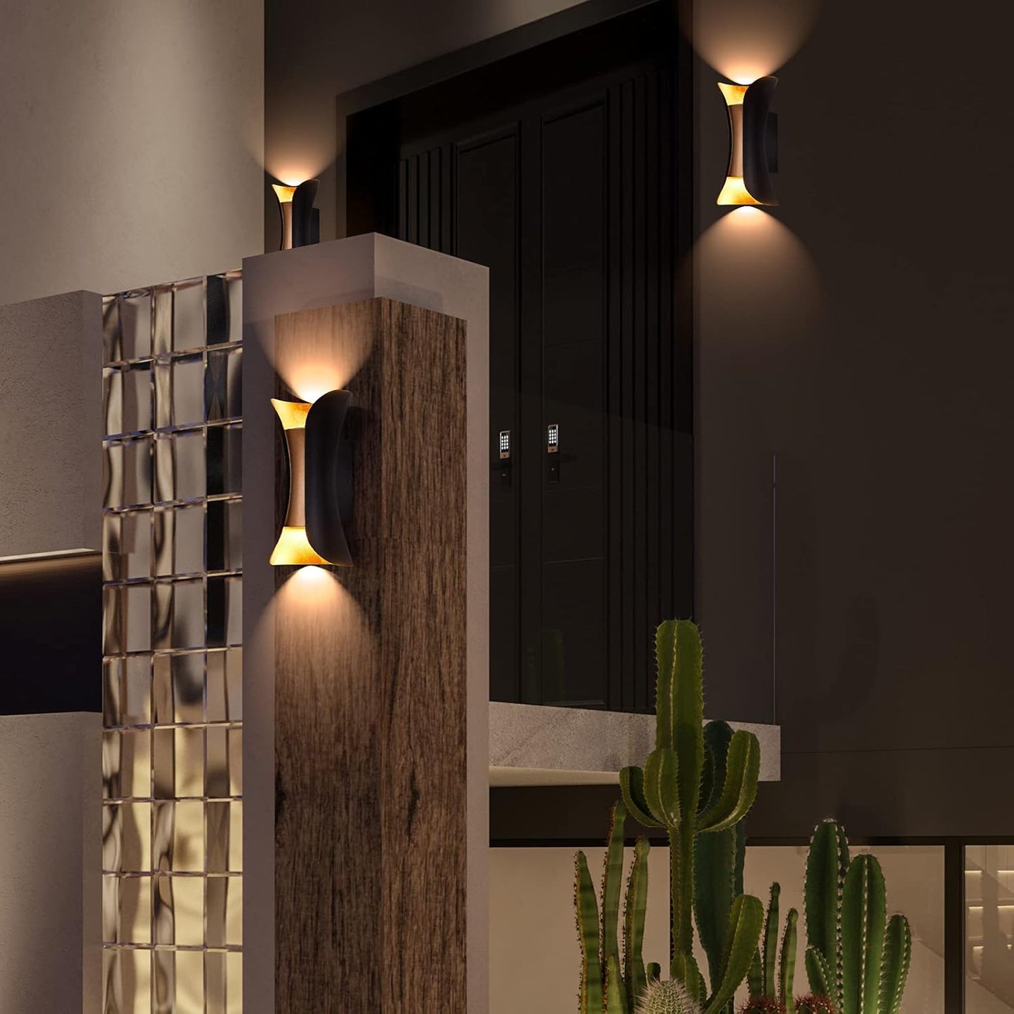 Modern outdoor wall lights with decorative glass panels and cacti in a garden setting.
