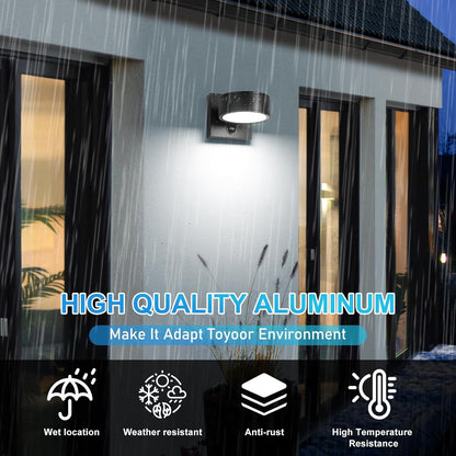 Outdoor wall light fixture on a building exterior with rainwater runoff system.