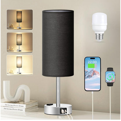 Black table lamp with USB ports, smartphone, and smartwatch on a neutral background