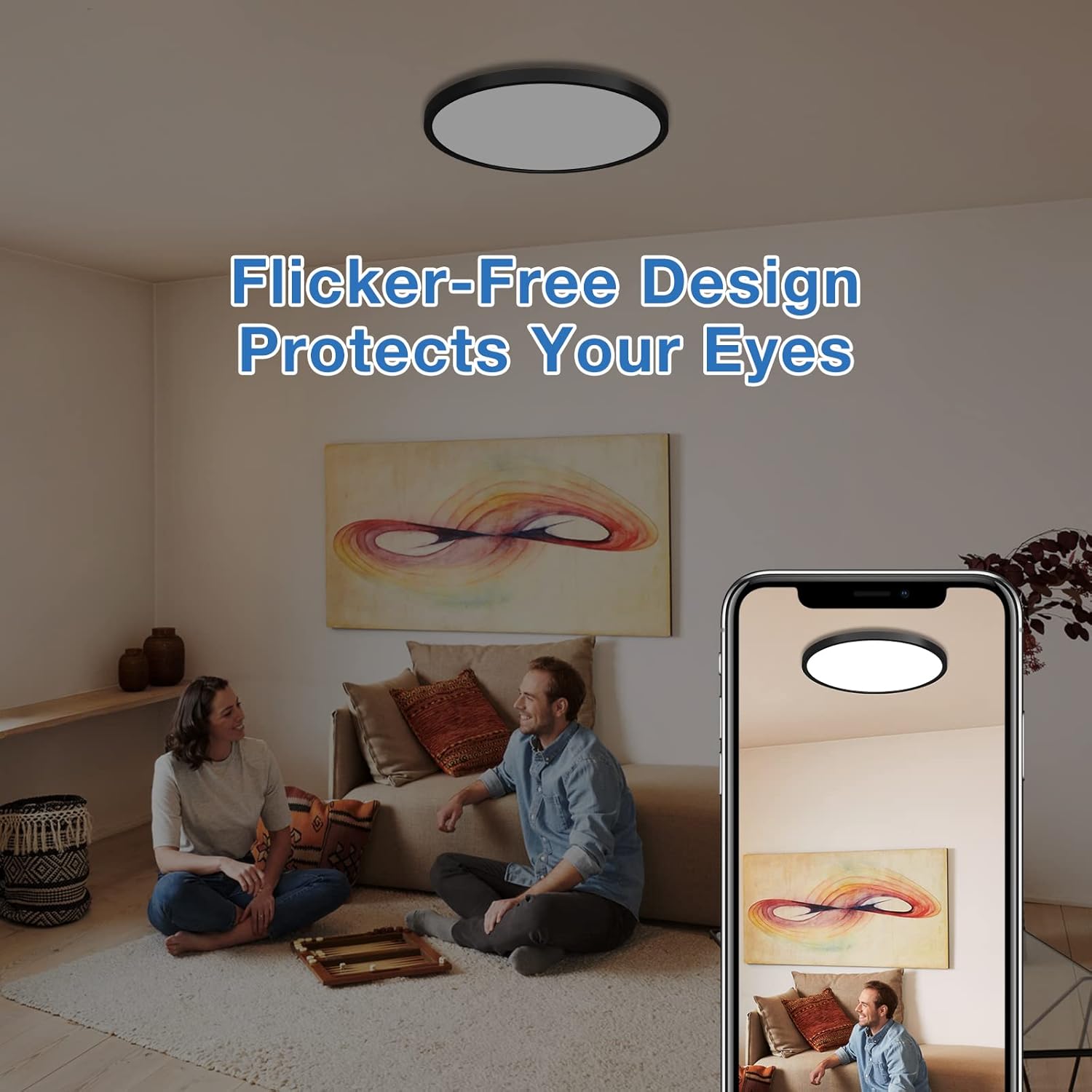 Living room with two people sitting on the floor, a painting on the wall, and a smartphone showing a ceiling light.