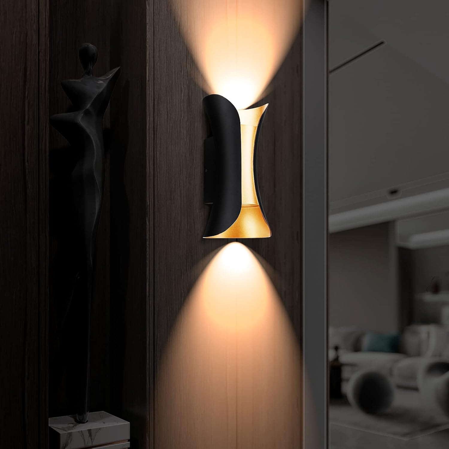 Modern wall lamp with a warm glow on a wooden wall.