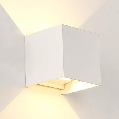 Modern white wall-mounted light fixture on a plain background
