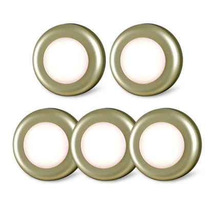 Set of five round light fixtures with a soft glow on a white background