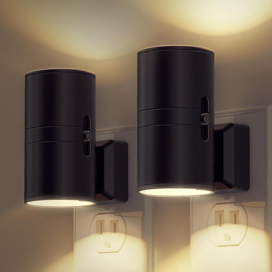 Two black wall-mounted outdoor lights on a neutral wall.