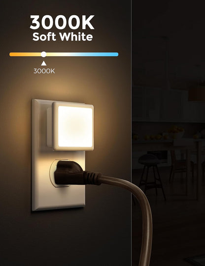 Wall-mounted light fixture with a plug-in cord, glowing softly in a dark room.