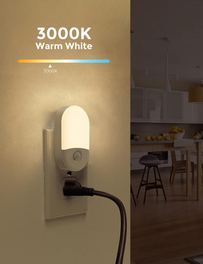 Wall-mounted night light emitting warm white light in a kitchen setting.
